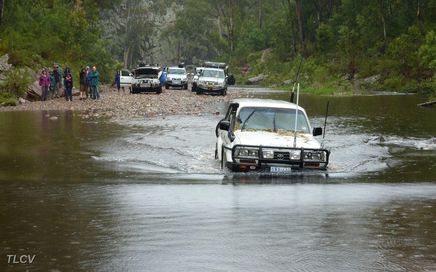 15-The convoy watches Zebra find the right line thru the Avon.JPG